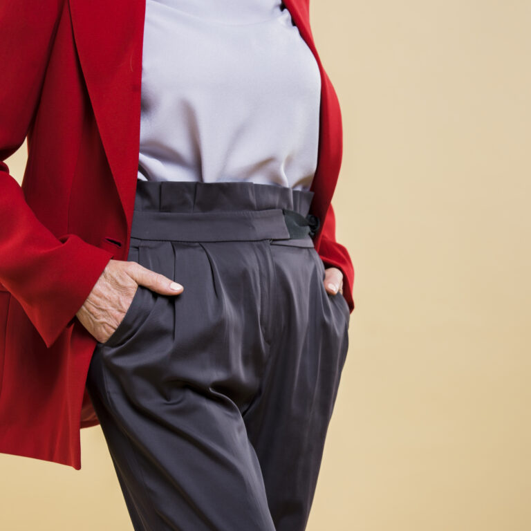 senior-woman-holding-her-hands-her-pockets